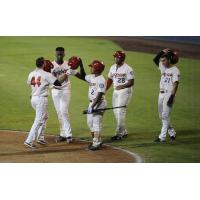 Spokane Indians exchange congratulations during a big night for their bats