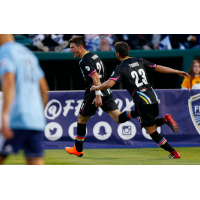 Las Vegas Lights FC midfielder Matt Thomas celebrates the first goal in Lights FC history