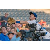 Zach McKinstry of the Tulsa Drillers attempts to catch a foul ball in the crowd