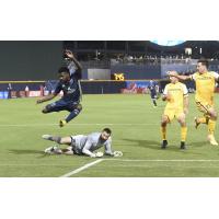 Bethlehem Steel FC's Chris Nanco leaps into the air to avoid the Nashville goalkeeper