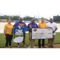 Biloxi Shuckers present check to Uplift Foundation