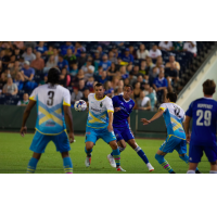 Las Vegas Lights FC's Sammy Ochoa (center) collects possession against Reno 1868 FC