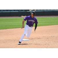 Josh Fuentes of the Albuquerque Isotopes rounds first