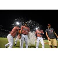 Charleston RiverDogs first baseman Dermis Garcia receives the water bucket treatment