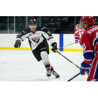 Aiden Barfoot of the Vancouver Giants chases the puck in preseason action vs. the Spokane Chiefs