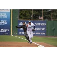 Lynchburg Hillcats first baseman Anthony Miller takes it to first himself