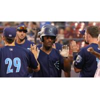 Everett AquaSox exchange high fives after a Game Two win