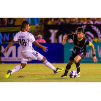 Las Vegas Lights FC's Carlos Alvarez (right) works around his younger brother, LA Galaxy II's Efrain Alvarez