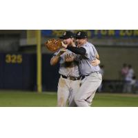 Jackson Generals infielders Marty Herum and Rudy Flores celebrate a Southern League title