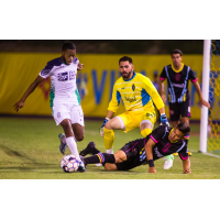 Las Vegas Lights FC goalkeeper Thomas Olsen (yellow) tracks action vs. OKC Energy FC