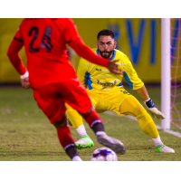 Las Vegas Lights FC goalkeeper Thomas Olsen prepares to make a save against Phoenix Rising