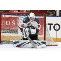 Kelowna Rockets goaltender Roman Basran smothers the puck