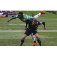 Fabian Herbers of Bethlehem Steel FC sends a member of the Tampa Bay Rowdies airborne